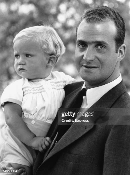 King Juan Carlos I of Spain with his baby son Prince Felipe, 29th July 1969.