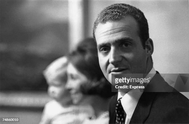King Juan Carlos I of Spain at the Zarzuela Palace, Madrid with his wife Queen Sofia and their baby son Felipe, 22nd December 1969.