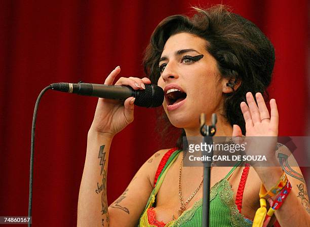 Pilton, UNITED KINGDOM: British pop singer Amy Winehouse performs at the Glastonbury music festival, in Pilton, Somerset, in south-west England, 22...