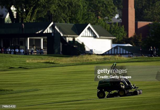 Members of the grounds crew operate mowers during the 107th U.S. Open Championship at Oakmont Country Club on June 13, 2007 in Oakmont, Pennsylvania.