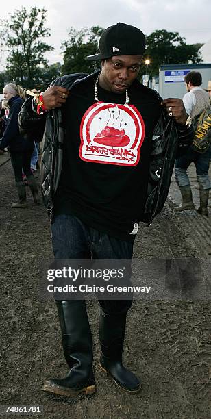 Dizzee Rascal walks backstage on the first day of the Glastonbury Festival at Worthy Farm, Pilton near Glastonbury, on June 22 2007 in Somerset,...