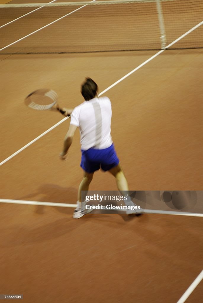 High angle view of a man playing tennis