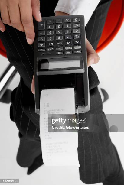 Woman Using A Adding Machine Hand Holding Paper Receipt Photos and Premium High Res Pictures - Getty ...