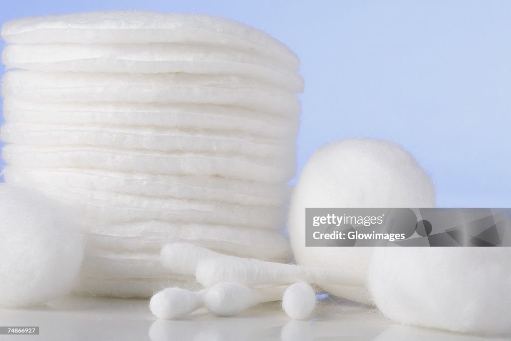 Close-up of cotton swabs with cotton balls