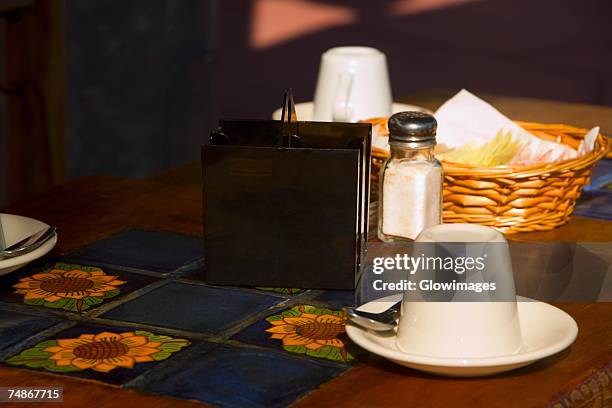 close-up of a dining table - napkin holder stock pictures, royalty-free photos & images