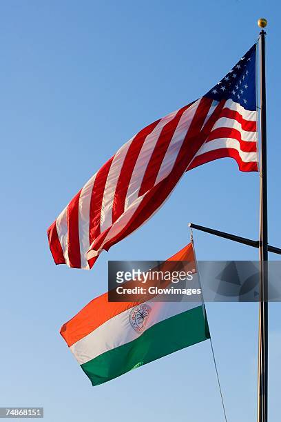 american flag and an indian flag fluttering - indian national flag stock pictures, royalty-free photos & images
