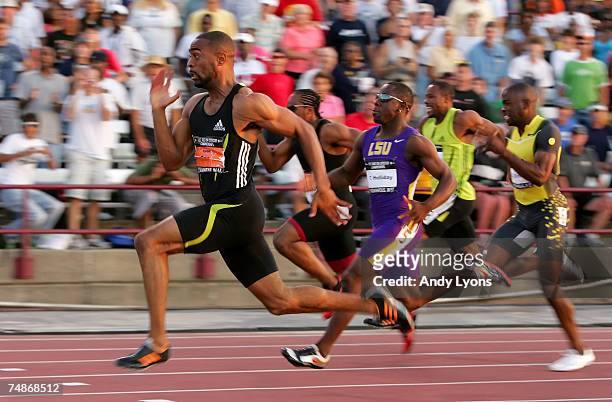 Tyson Gay competes in the finals of the men's 100 meter dash on the second day of the AT&T USA Outdoor Track and Field Championships at IU Michael A....