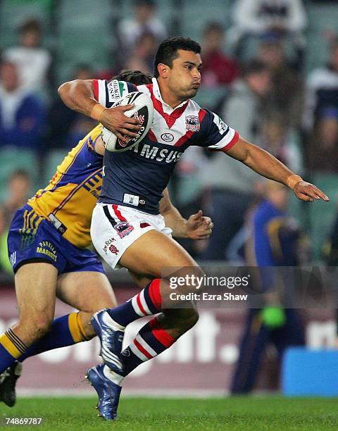 Craig Wing of the Roosters runs with the ball during the round 15 NRL match between the Sydney Roosters and the Parramatta Eels at Aussie Stadium on...