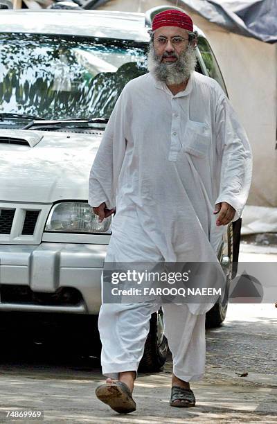 Abdul Rashid Ghazi, one of two brothers who head the Red Mosque, steps towards media representatives gathred at the Jamia Hafsa seminary where nine...