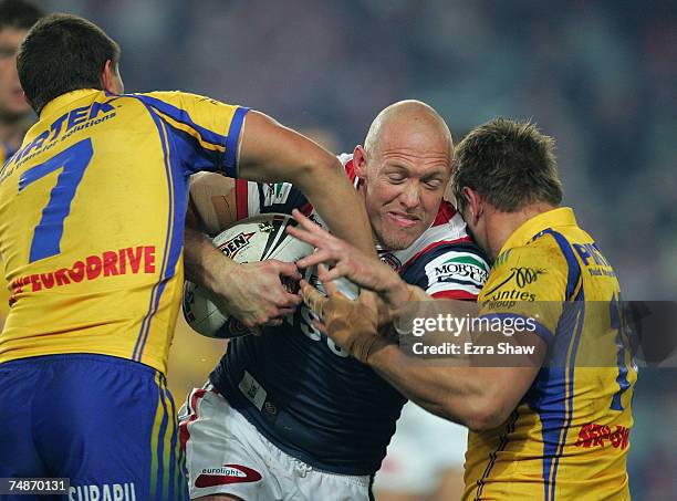 Craig Fitzgibbon of the Roosters is tackled by the Eels during the round 15 NRL match between the Sydney Roosters and the Parramatta Eels at Aussie...