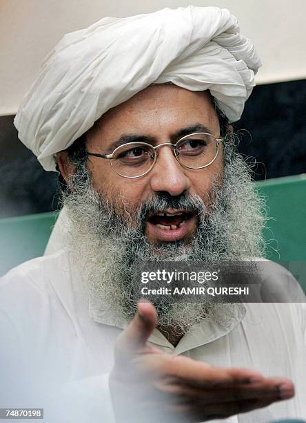 Abdul Rashid Ghazi, deputy head of the Red Mosque gestures as he announces the release of Chinese hostages during a press conference in Islamabad, 23...