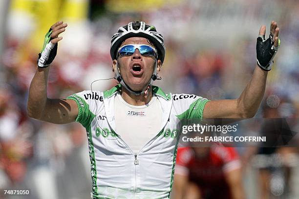 Schwarzsee, SWITZERLAND: Colombian rider Rigoberto Uran raises his arms in victory a he crosses the finish line to win in the 71st Tour de Suisse UCI...