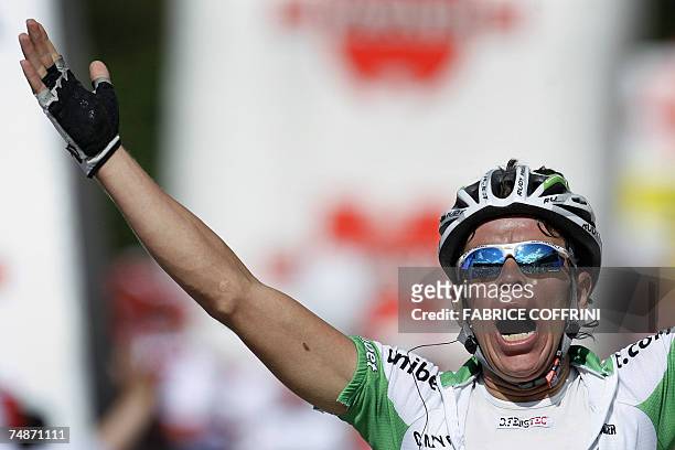 Schwarzsee, SWITZERLAND: Colombian Rigoberto Uran raises his arms in victory a he crosses the finish line to win in the 71st Tour de Suisse UCI...