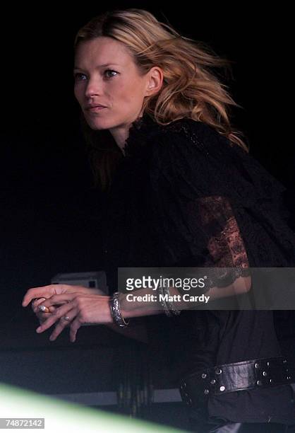 Kate Moss waits to come on stage with her boyfriend Pete Doherty's band Babyshambles on the Other Stage at Worthy Farm, Pilton near Glastonbury, on...