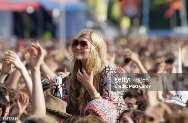 Music fan watches as Pete Doherty of Babyshambles performs on the Other Stage at Worthy Farm, Pilton near Glastonbury, on June 23 2007 in Somerset,...