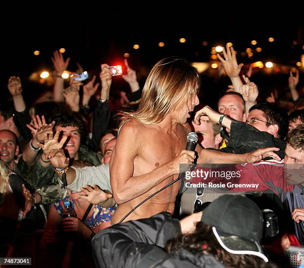 Iggy Pop jumps into the crowd off the Other Stage on the second day of the Glastonbury Festival at Worthy Farm, Pilton near Glastonbury, on June 23,...