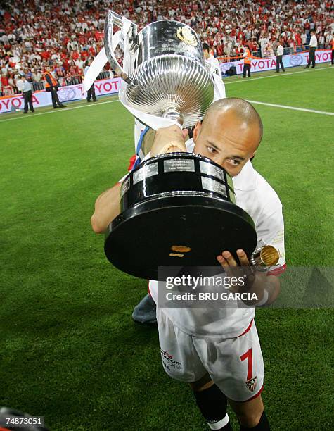 Sevilla's Ernesto Javier kisses the trophy after beating Getafe by 1-0 in the final of the King's Cup at the Santiago Bernabeu stadium in Madrid, 23...