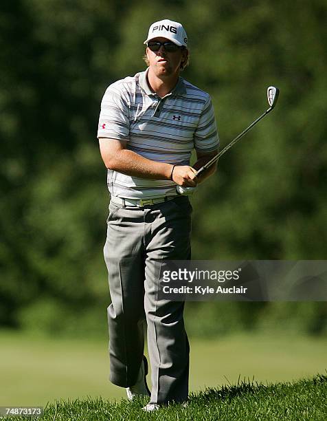 Hunter Mahan watches his second shot on the 13th hole during the third round of the Travelers Championship at the TPC River Highlands June 23, 2007...