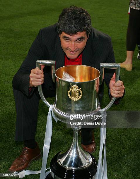 Sevilla manager Juande Ramos celebrates with the Copa del Rey trophy after Sevilla beat Getafe 1-0 in the Copa del Rey final at the Santiago Bernabeu...