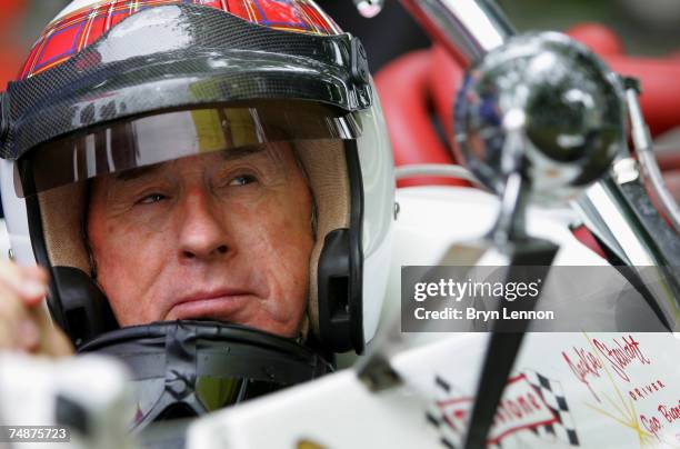 Triple World Champion Jackie Stewart prepares to drive a Lola up the Goodwood Festival of Speed on June 24, 2007 in Chichester, England.