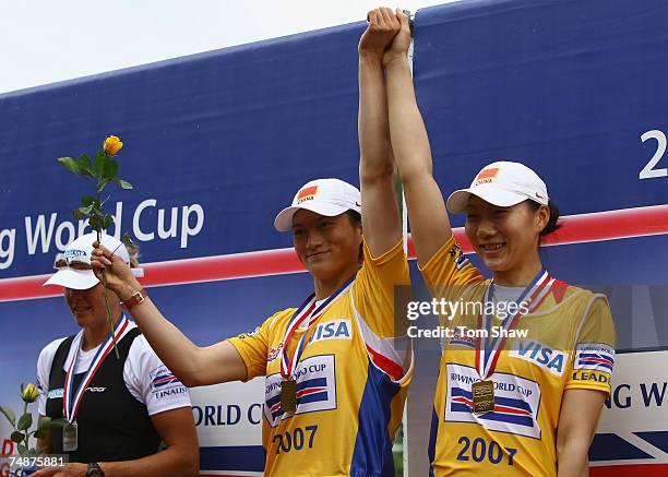 Yage Zhang and Yulan Gao of China 1 celebrate winning gold in the Womens Pairs during day 3 of the FISA Rowing World Cup at the Bosbaan on June 24,...