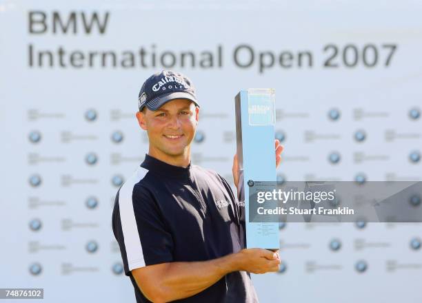 Niclas Fasth of Sweden poses whith the trophy during the final round of The BMW International Open Golf at The Munich North Eichenried Golf Club on...