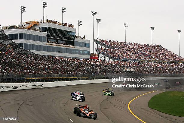 Dario Franchitti drives the Canadian Club Andretti Green racing Dallara Honda around turn one during the IRL Indycar Series Iowa Corn Indy 250 on...