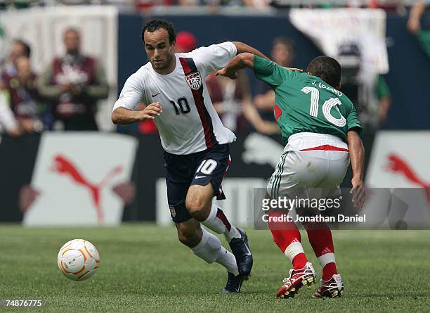 Landon Donovan of the USA controls the ball against Jamie Lozano of Mexico during the CONCACAF Gold Cup Final match at Soldier Field on June 24, 2007...