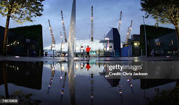 Security guard stands watch on as the lights are lit on the newly branded O2 Arena on June 24, 2007 in London, England. The Arena is owned by AEG has...