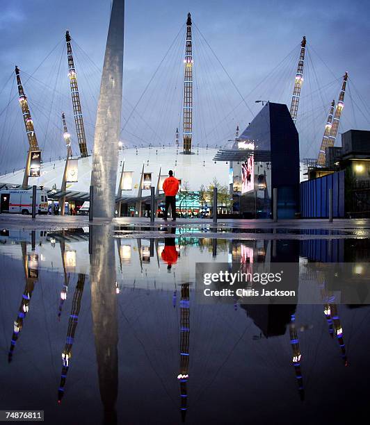 Security guard stands watch on as the lights are lit on the newly branded O2 Arena on June 24, 2007 in London, England. The Arena is owned by AEG has...