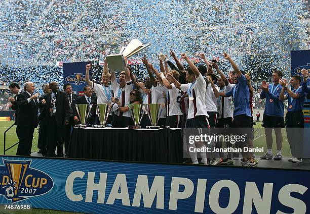 Team USA celebrates with the trophy after their 2-1 win against Mexico during the CONCACAF Gold Cup Final match at Soldier Field on June 24, 2007 in...