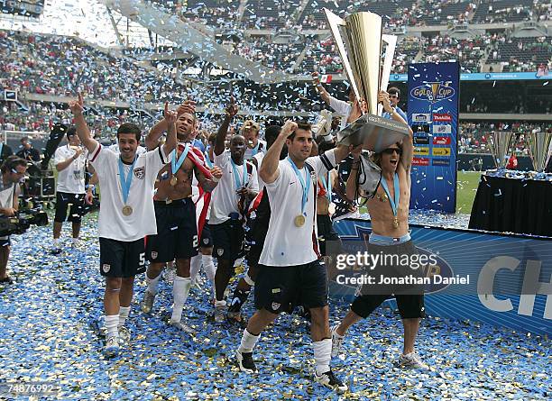 Carlos Bocanegra and Frankie Hejduk of the USA celebrate with the trophy after their 2-1 win against Mexico during the CONCACAF Gold Cup Final match...