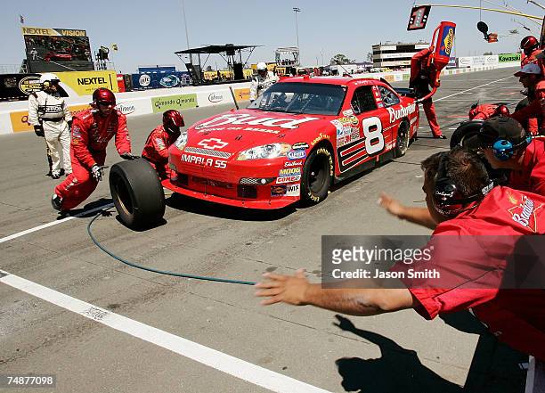 Dale Earnhardt Jr., driver of the Budweiser Chevrolet, makes a pit stop, during the NASCAR Nextel Cup Series Toyota/Save Mart 350 at Infineon Raceway...