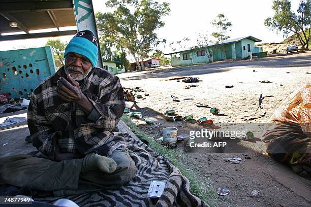 Alice Springs, AUSTRALIA: An Aboriginal elder spends time at one of the town camp's in Alice Springs, 19 May 2007. Police backed by military support...