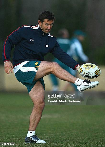 Former Rugby League player Andrew Johns instructs Wallabies players on his kicking technique during an Australian Wallabies training session at...