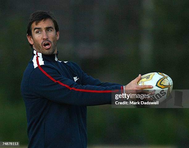 Former Rugby League player Andrew Johns instructs Wallabies players on his technique during an Australian Wallabies training session at Xavier...