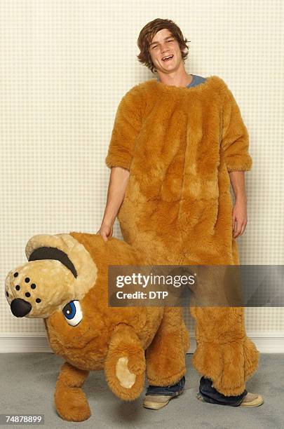 young man wearing dog costume, smiling, portrait - man in costume stock pictures, royalty-free photos & images