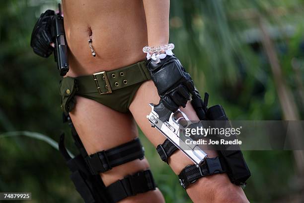 Andrea Brooke Ownbey films a scene on the set of Girls and Guns, a web-based reality show featuring women shooting weapons June 23, 2007 in...