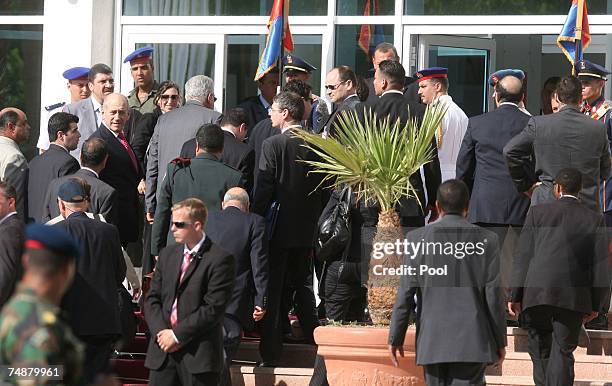 Israeli Prime Minister Ehud Olmert walks with his Israeli delegation into the congress center to meet Egyptian President Hosni Mubarak, Palestinian...