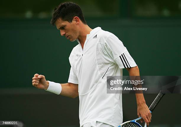 Tim Henman of Great Britain reacts during his Men's Singles first round match against Carlos Moya of Spain during day one of the Wimbledon Lawn...