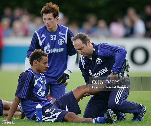 Jermaine Jones receives medical treatment of fitness coach Rouven Schirp during the training session of FC Schalke 04 at their training ground on...
