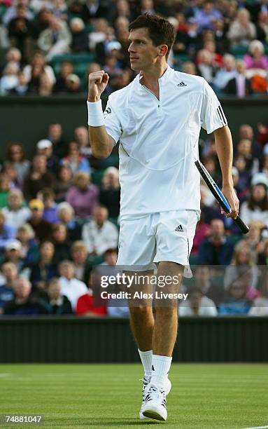 Tim Henman of Great Britain clenches his fist during his Men's Singles first round match against Carlos Moya of Spain during day one of the Wimbledon...
