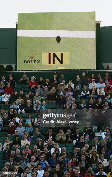 The hawkeye system displays a decision on the screen during the Men's Singles first round match between Tim Henman of Great Britain and Carlos Moya...
