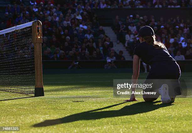 Ball girl looks on during the Men's Singles first round match between Tim Henman of Great Britain and Carlos Moya of Spain during day one of the...