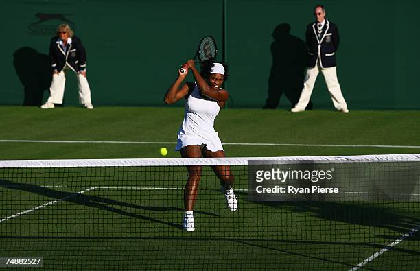 Serena Williams of USA reacts during the Women's Singles first round match against Lourdes Dominguez-Lino of Spain during day one of the Wimbledon...