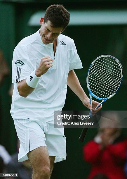 Tim Henman of Great Britain reacts during his Men's Singles first round match against Carlos Moya of Spain during day one of the Wimbledon Lawn...