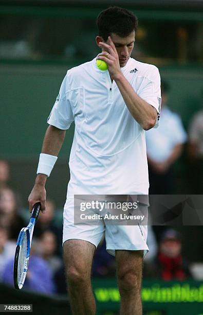 Tim Henman of Great Britain looks thoughtful during his Men's Singles first round match against Carlos Moya of Spain during day one of the Wimbledon...
