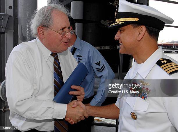 Capt. Herman Shelanski, commander of the Nimitz-class aircraft carrier USS Harry S. Truman, welcomes Sen. Carl Levin , chairman of the Senate Armed...