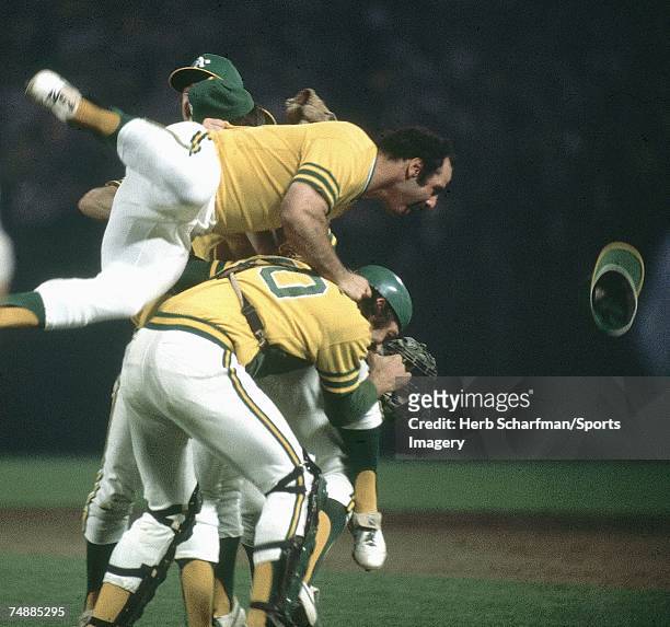 Sal Bando of the Oakland Athletics jumps on top of teammates after defeating the Los Angeles Dodgers in Game 5 of the World Series on October 17,...