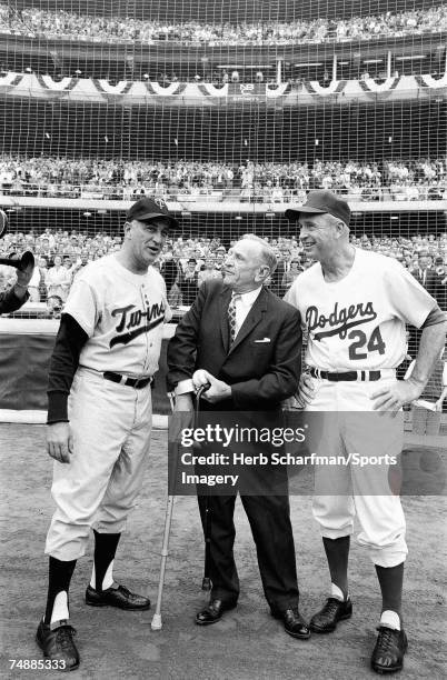 Casey Stengel talks with Minnesota Twins Manager Sam Mele and Los Angeles Dodgers Manager Walter Alston prior to a 1965 World Series Game in October...